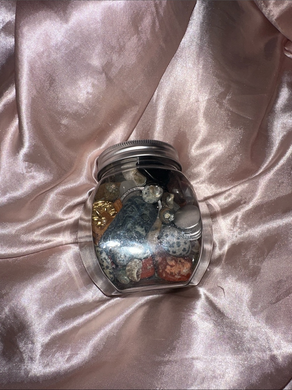 Plastic jar filled with mystery crystals, shells and charms!